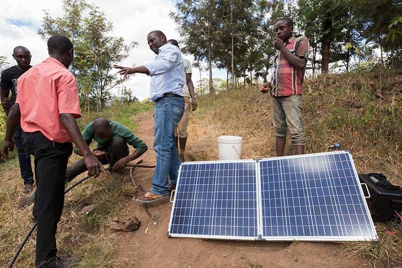 Charles Ngatia Kaombe, an Agriculture Engineer, gives a demonstration of the Sunculture Rain Maker.