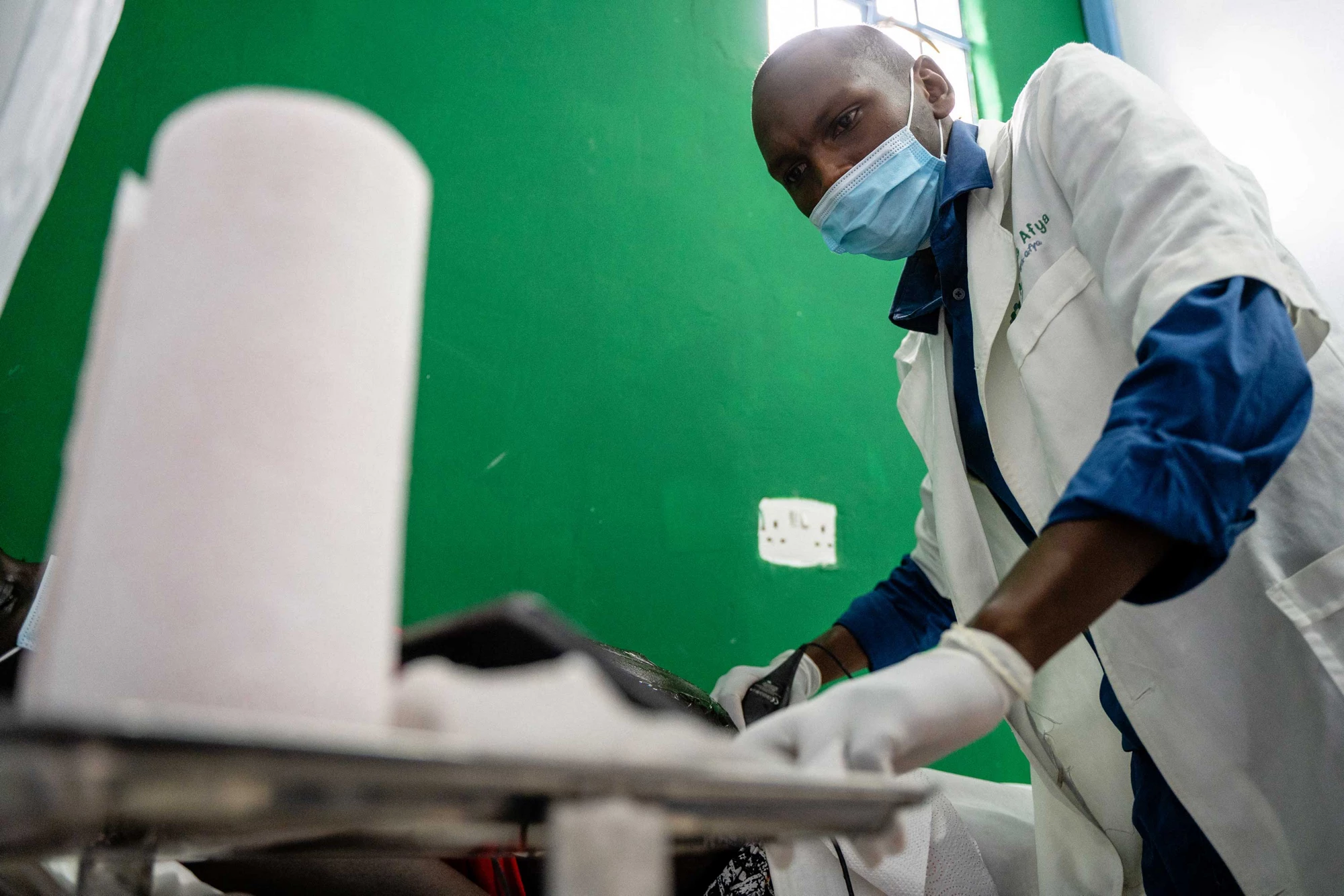 A sonographer at Access Afya administers an ultrasound using Butterfly IQ technology. Photo: Daniel Ndung'u/ IFC